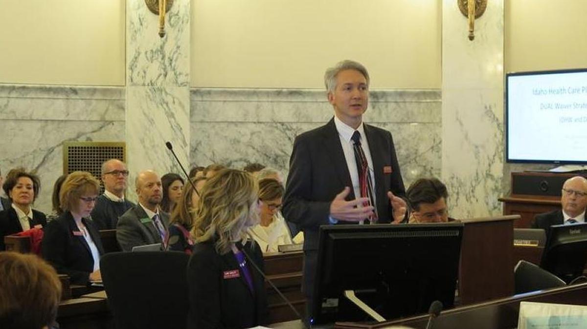 Idaho Department of Health and Welfare Director Russ Barron, addresses the Legislature’s Joint Finance-Appropriations Committee on Jan. 15, 2018, along with Deputy Director Lori Wolff, left, and state Insurance Director Dean Cameron, right.
