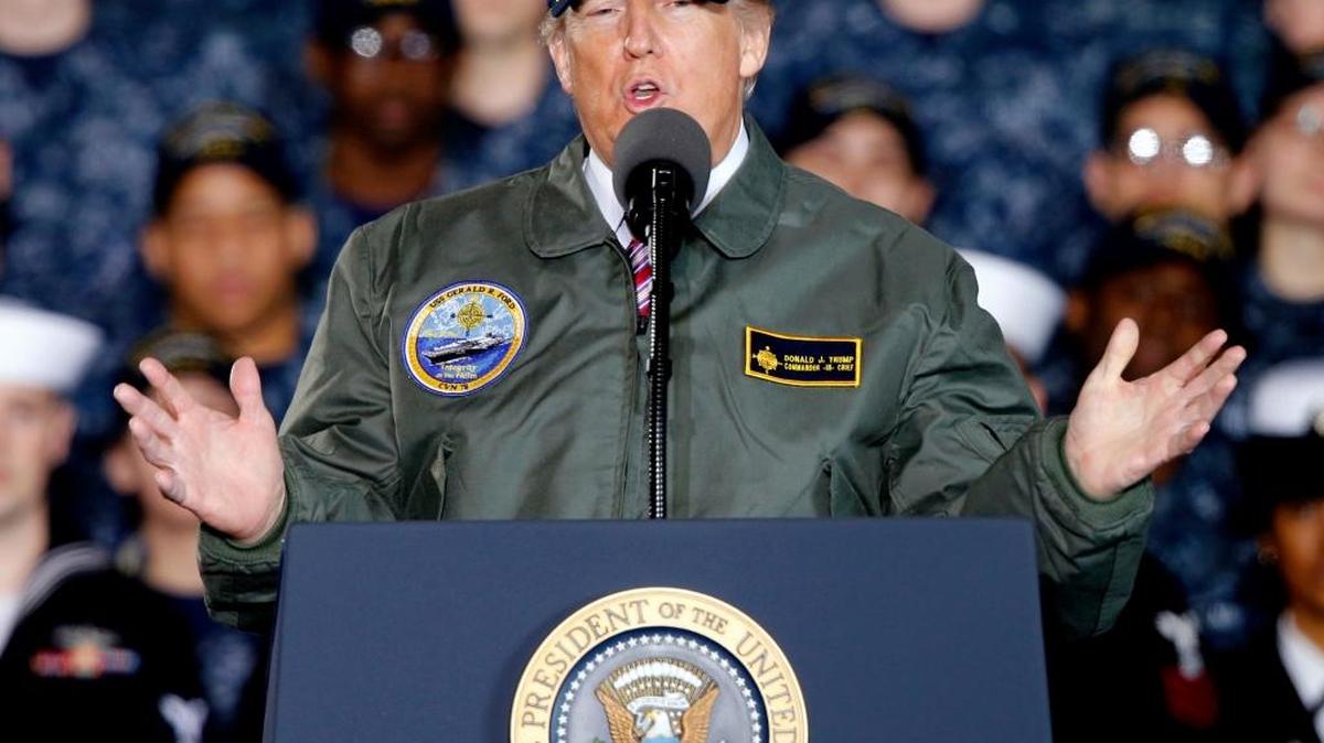 In this March 2, 2017, photo, President Donald Trump gestures as he speaks to Navy and shipyard personnel.