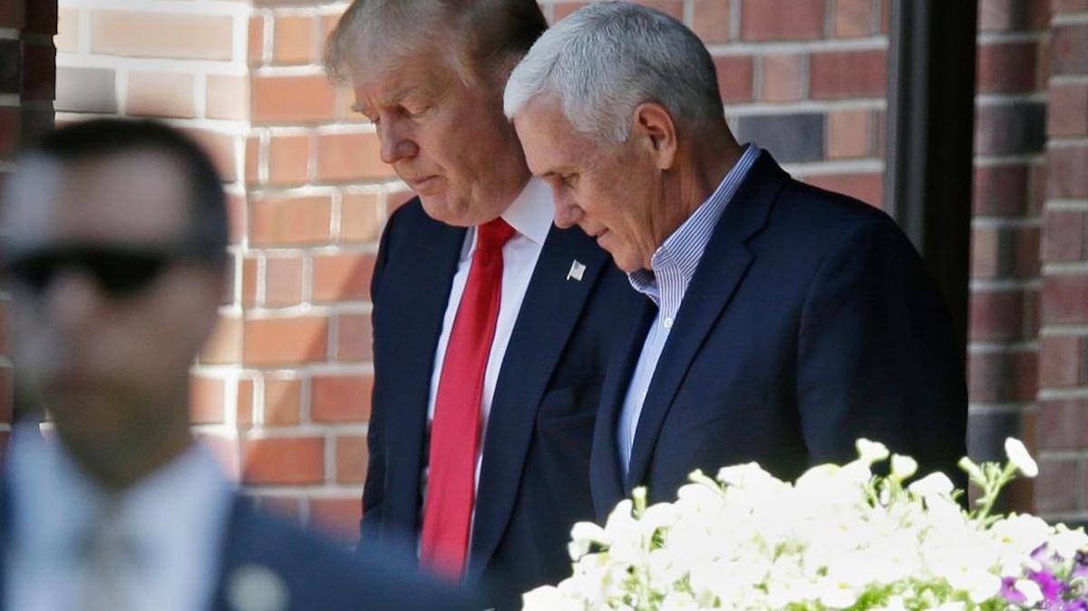 In this July 13, 2016 file photo, Republican presidential candidate Donald Trump leaves the Indiana Governor's residence with Gov. Mike Pence in Indianapolis. Trump has chosen Pence as his running mate, adding political experience and conservative bona fides to his Republican presidential ticket. (AP)