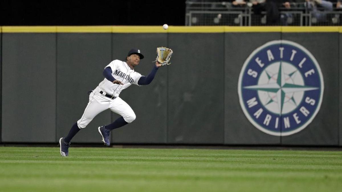 Mariners center fielder Mallex Smith tracks a fly ball during the late innings of a game last Tuesday in Seattle.