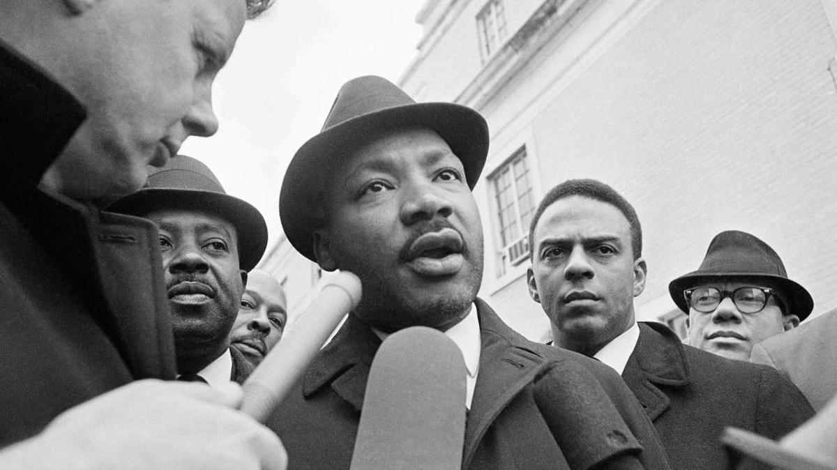 Dr. Martin Luther King Jr. interviewed by newsmen as he left jail in Selma, Ala., in 1965.