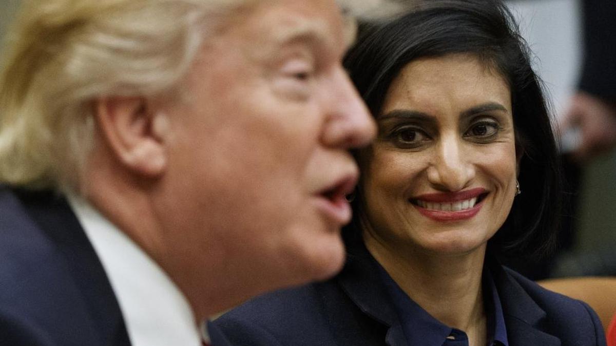 Seema Verma, administrator of the Centers for Medicare and Medicaid Services, right, with President Donald Trump in March 2017. The Trump administration says it’s offering a path for states that want to seek work requirements for Medicaid recipients, a policy shift toward low-income people.