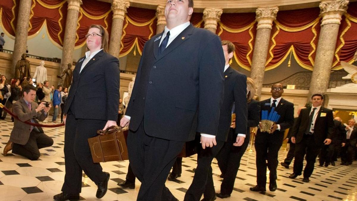 Pages lead a Senate procession carrying two boxes holding Electoral College votes through Statuary Hall to the House Chamber on Capitol Hill on Capitol Hill in Washington, Friday, Jan. 4, 2013, for the counting of the votes in the presidential election. A tally of the U.S. Electoral College vote affirmed President Barack Obama's re-election. (AP)