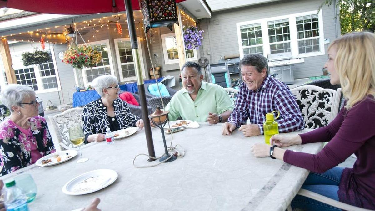 It was a night of celebration for those helping drive the West Ada recall. From left, Christine Donnell, Lori Jones, Trustee Mike Vuittonet, Reid Olsen and Caroline Merritt have dinner at Vuittonet’s house.