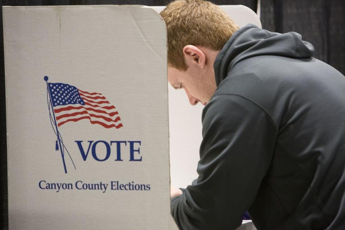 Canyon County voters will select from nearly 100 candidates running various city offices in the November election. A voter casts a ballot O’Connor Field House in Caldwell.