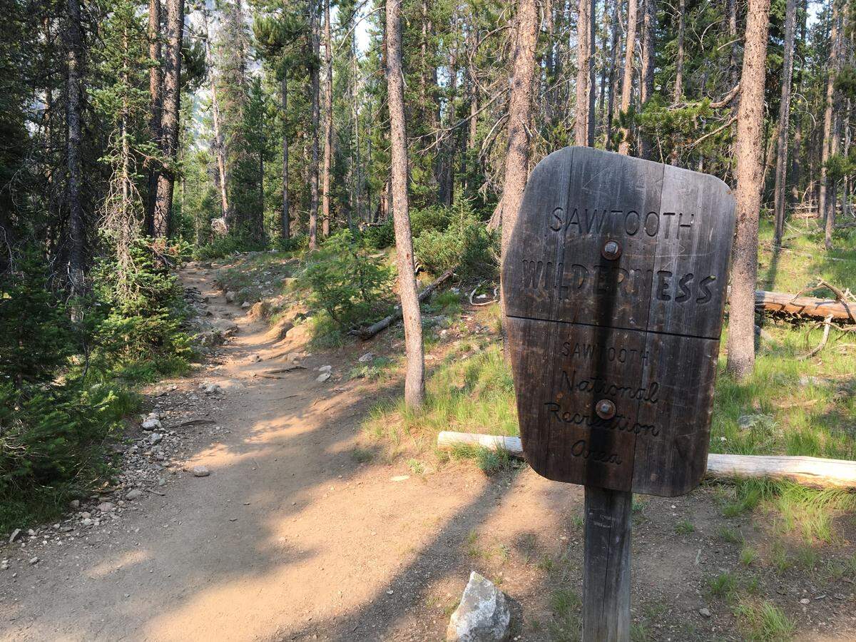 A sign on the Iron Creek-Stanley Lake Trail marks the spot where visitors enter the Sawtooth Wilderness Area within the Sawtooth National Recreation Area. It’s important to know the rules within any wilderness area you’re visiting, such as keeping your dog on a leash from July 1 through Labor Day in the Sawtooth Wilderness.