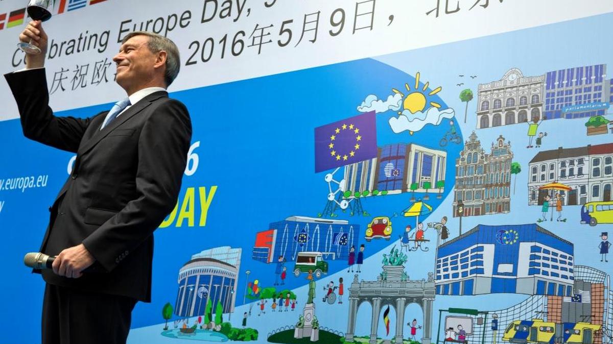 Hans Dietmar Schweisgut, EU ambassador to China, toasts after delivering the opening speech at an event to mark Europe Day in Beijing, China, Monday, May 9, 2016. (AP)
