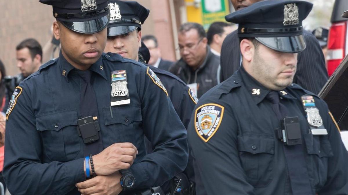 A police officers wear newly issued body camera as they leave the 34th precinct, Thursday, April 27, 2017, in New York. The New York Police Department is launching the first phase of a plan to equip 22,000 officers with body cameras. (AP)