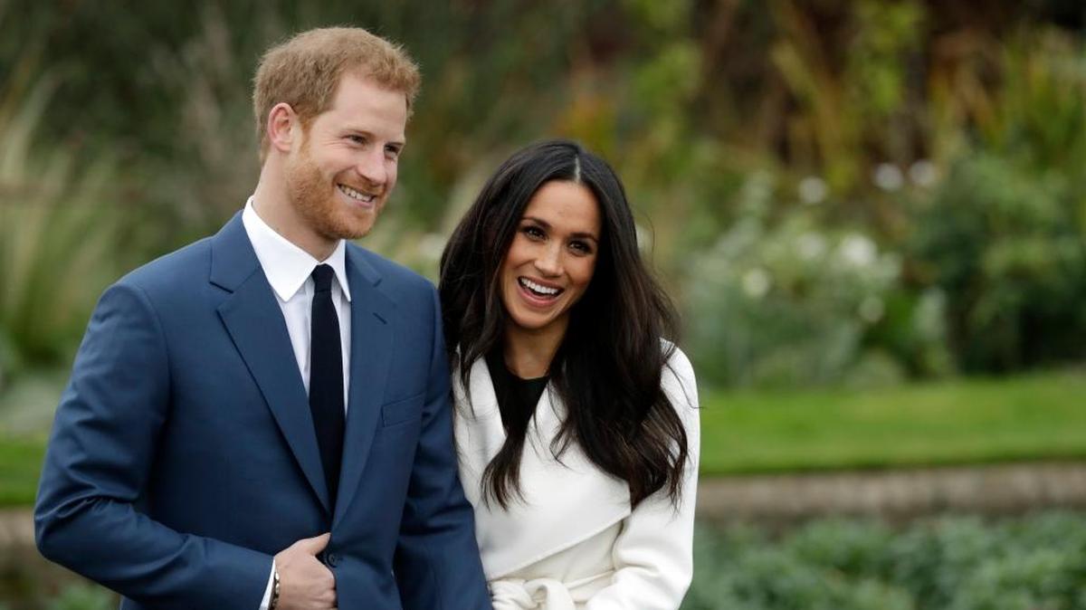 Britain's Prince Harry and his fiancee Meghan Markle pose for photographers in London Monday.