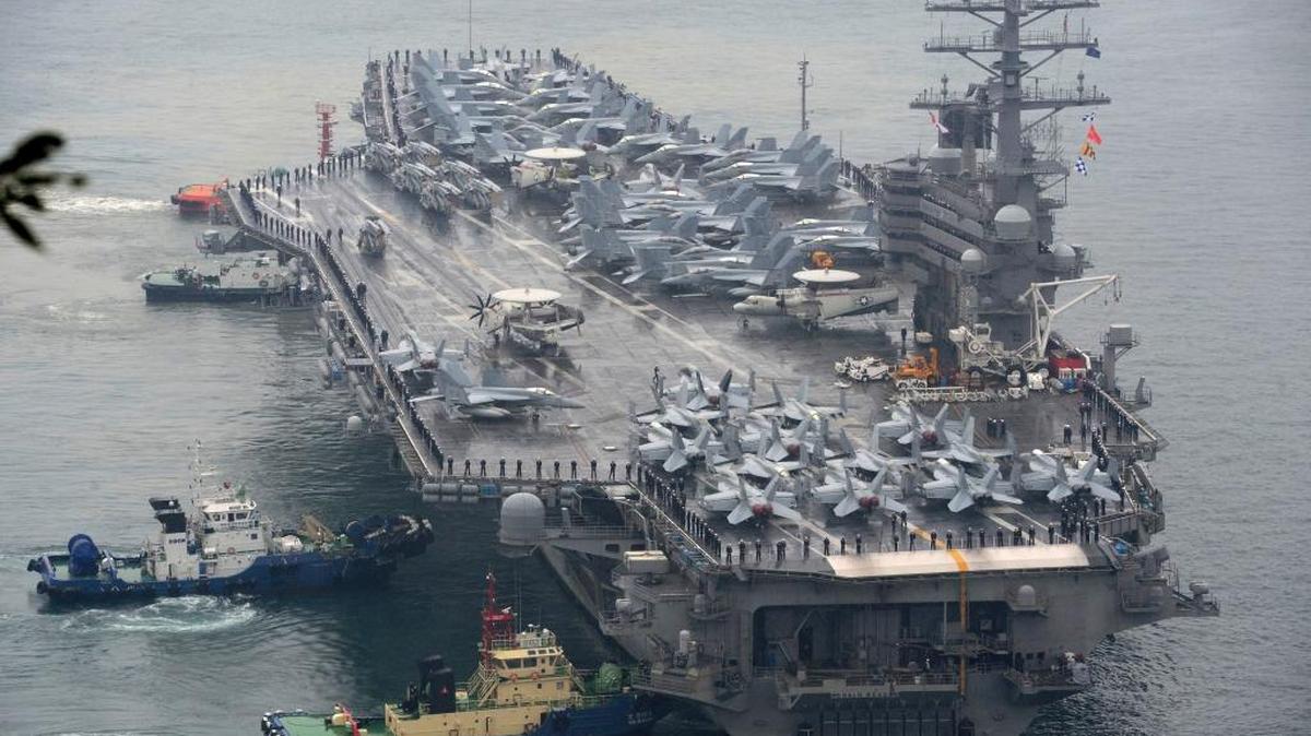 The USS Ronald Reagan aircraft carrier is escorted into Busan port, South Korea, after completing a joint drill with the South Korean navy in southern waters off the Korean Peninsula, Sunday, Oct. 16, 2016. South Korea and the U.S. said Sunday that the latest missile launch by North Korea ended in a failure after the projectile reportedly exploded soon after liftoff. (AP)