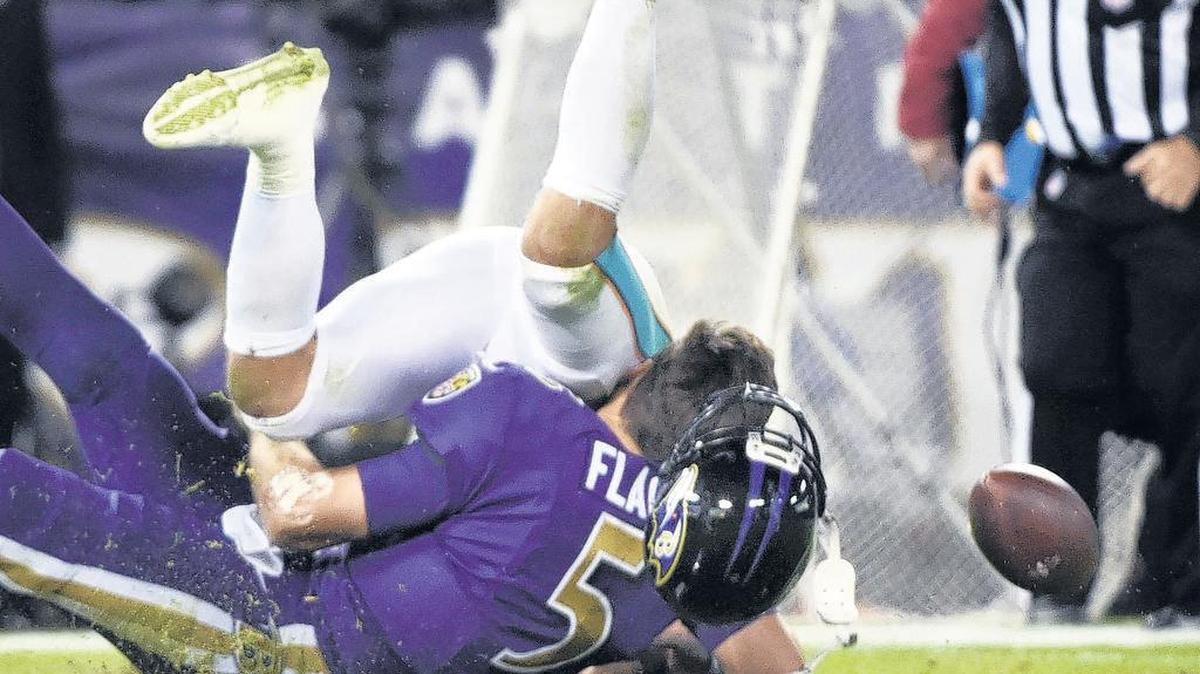 The Dolphins’ Kiko Alonso smashes into Baltimore quarterback Joe Flacco in a game in October 2017. Alonso hit Flacco late and directly to the head, and was penalized and fined. Flacco suffered a concussion.
