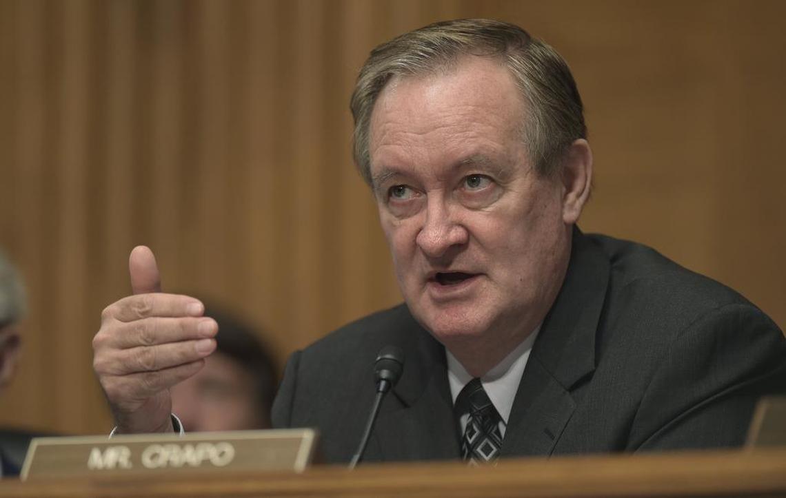 Senate Banking Committee Chairman Sen. Mike Crapo, R-Idaho, thinks the Justice Department should address the potential legal threat facing banks that do business with companies serving marijuana firms before Congress takes up the issue.