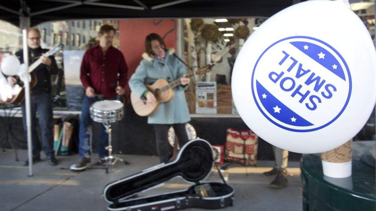 Buskers, including a.k.a. Belle, perform outside the Record Exchange in Boise in honor of Small Business Saturday on Nov. 29, 2014.