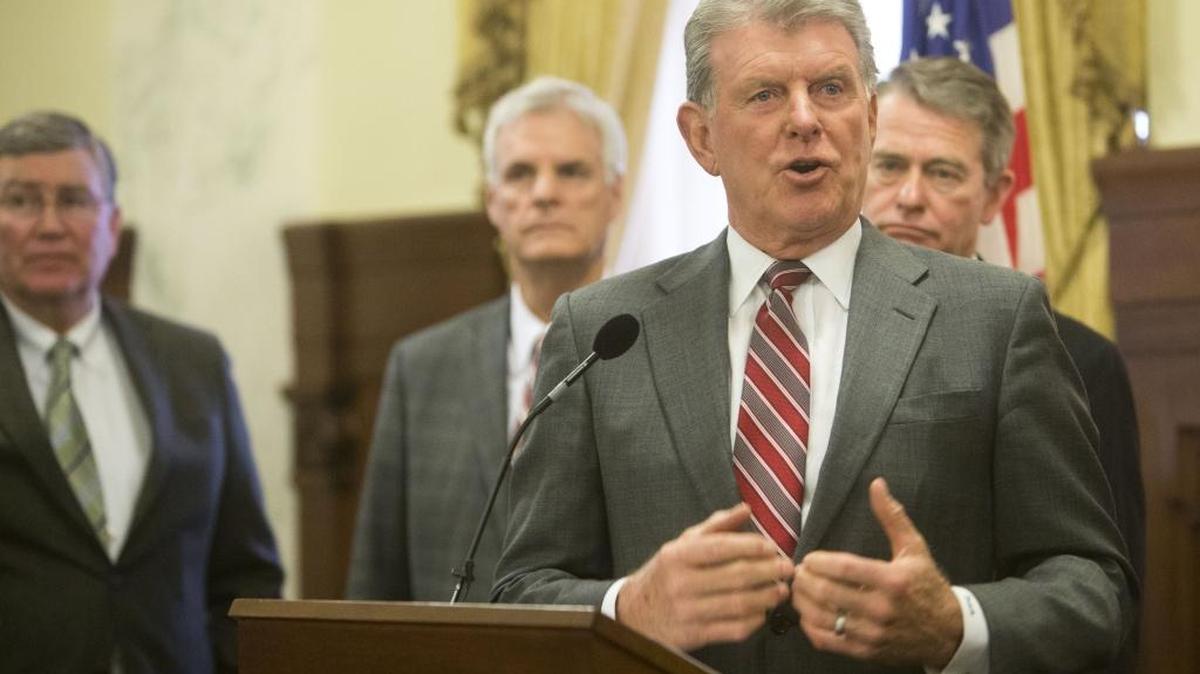 Gov. Butch Otter speaks in April following the close of the 2016 legislative session. Behind him, from left: House Speaker Scott Bedke, Senate Pro Tem Brent Hill, Lt. Gov. Brad Little.