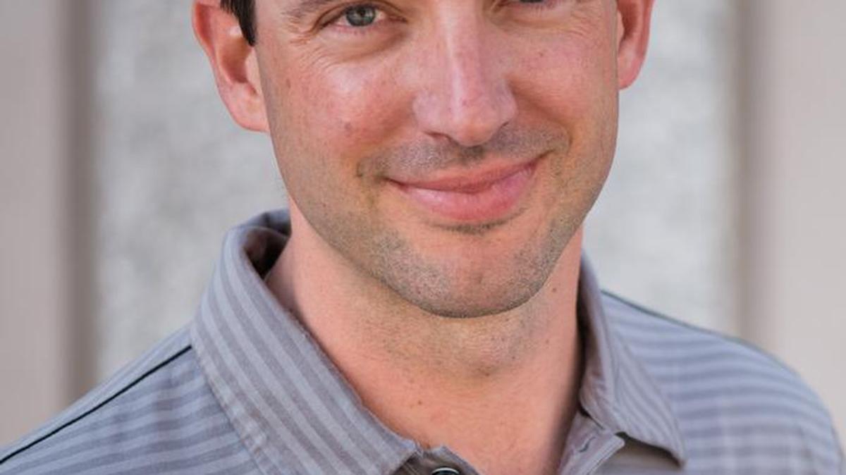Adam J. Richins