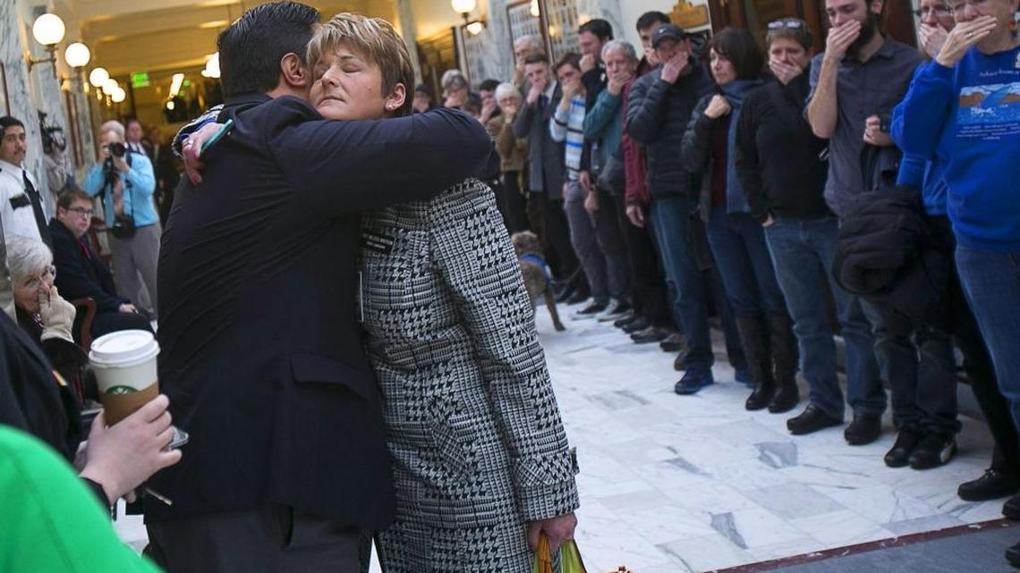 Rep. John McCrostie, left, and Rep. Melissa Wintrow console each other in the Capitol after the House State Affairs Committee voted down a bill to add the words “sexual orientation” and “gender identity” to Idaho’s Human Rights Act in January 2015.