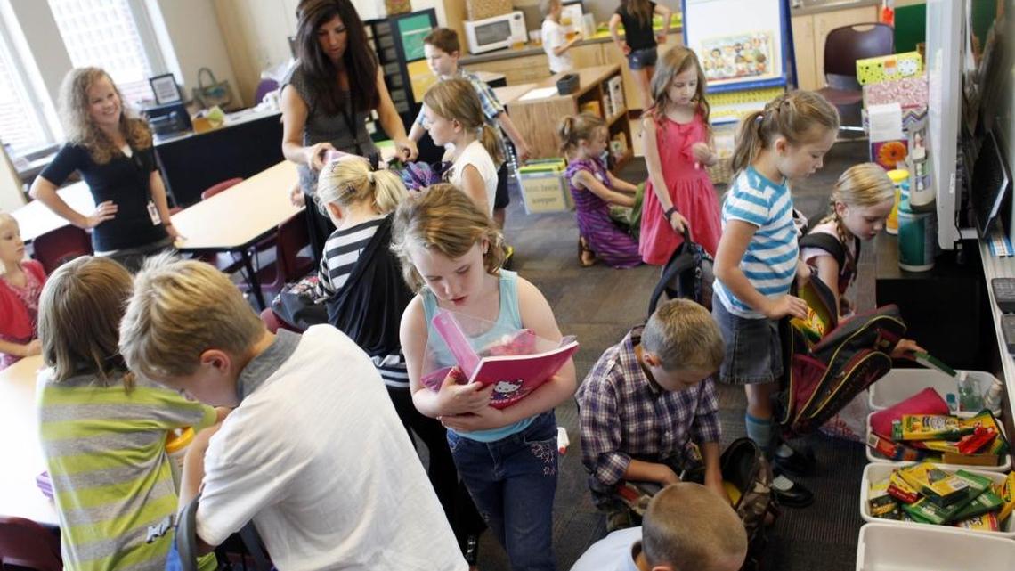 Second-graders at Roosevelt Elementary organize supplies on the first day of school in this 2012 photograph. Boise School District is considering a plan to start and end its school year earlier than it does now.