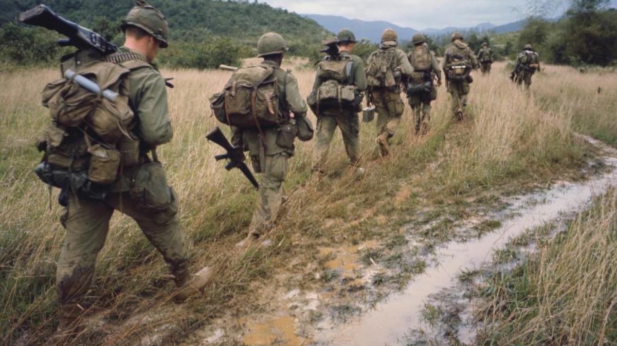 Soldiers march on patrol during the Vietnam War.
