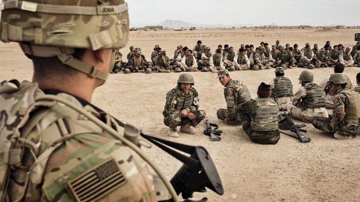 FILE -- U.S. Army soldiers oversee training of the 215th Corps of the Afghan National Army at Camp Bastion in Helmand Province, Afghanistan, on March 22, 2016. (Adam Ferguson/The New York Times)