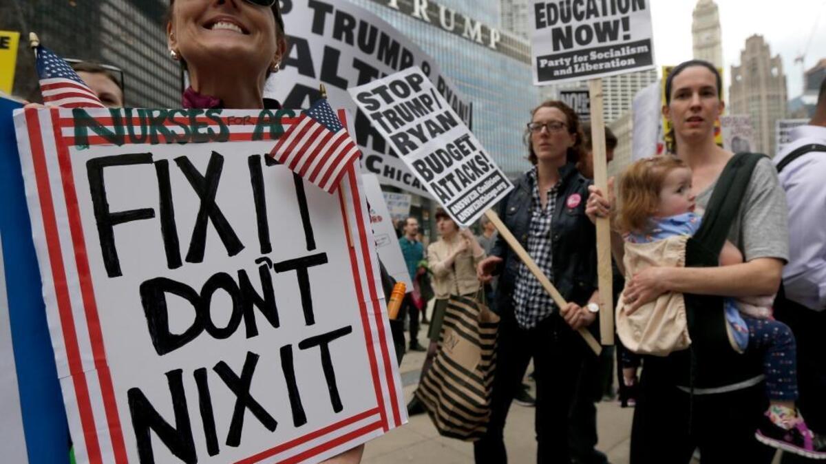 Idaho’s insurance director Dean Cameron says the reapeal and replacement of Obamacare needs to happen — and the overhaul will likely benefit Idahoans. But protesters — like these folks who gathered in Chicago in March — aren’t yet convinced. (AP)