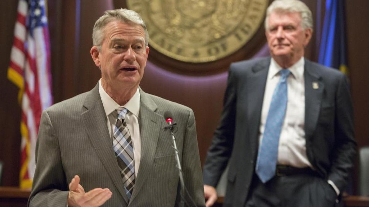 Idaho Lt. Gov. Brad Little, with Gov. Butch Otter listening, speaks to reporters about a health insurance executive order the two unveiled Jan. 5 at the Capitol.