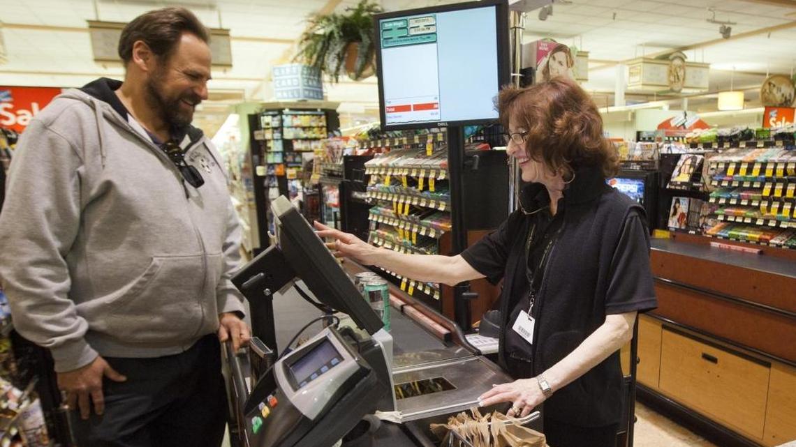 Cashier Saundra Miller helps customer Darren Sand at the Albertsons at State and 16th streets in Boise in March 2013, two months before Minnesota-based Supervalu sold this store and its other surviving stores from the old Albertsons Inc. chains.