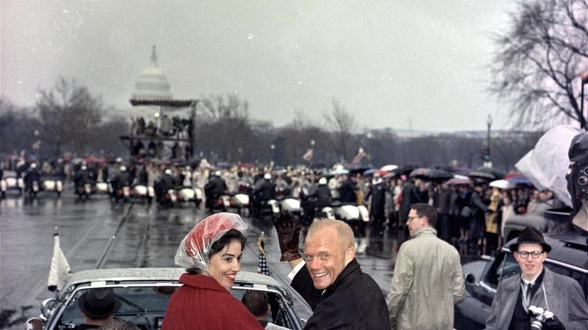 Mercury Astronaut John Glenn, and his wife, Annie, ride with Vice President Lyndon Johnson during a parade in Glenn’s honor in Washington on Feb. 26, 1962.
