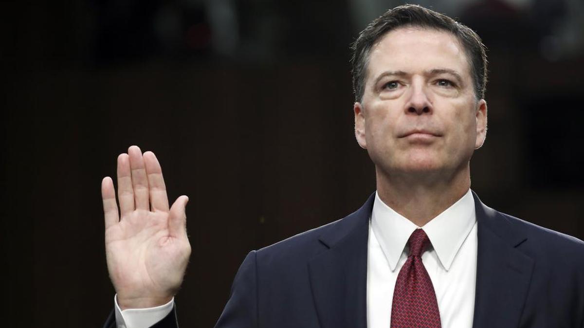 Former FBI Director James Comey is sworn in during a Senate Intelligence Committee hearing.