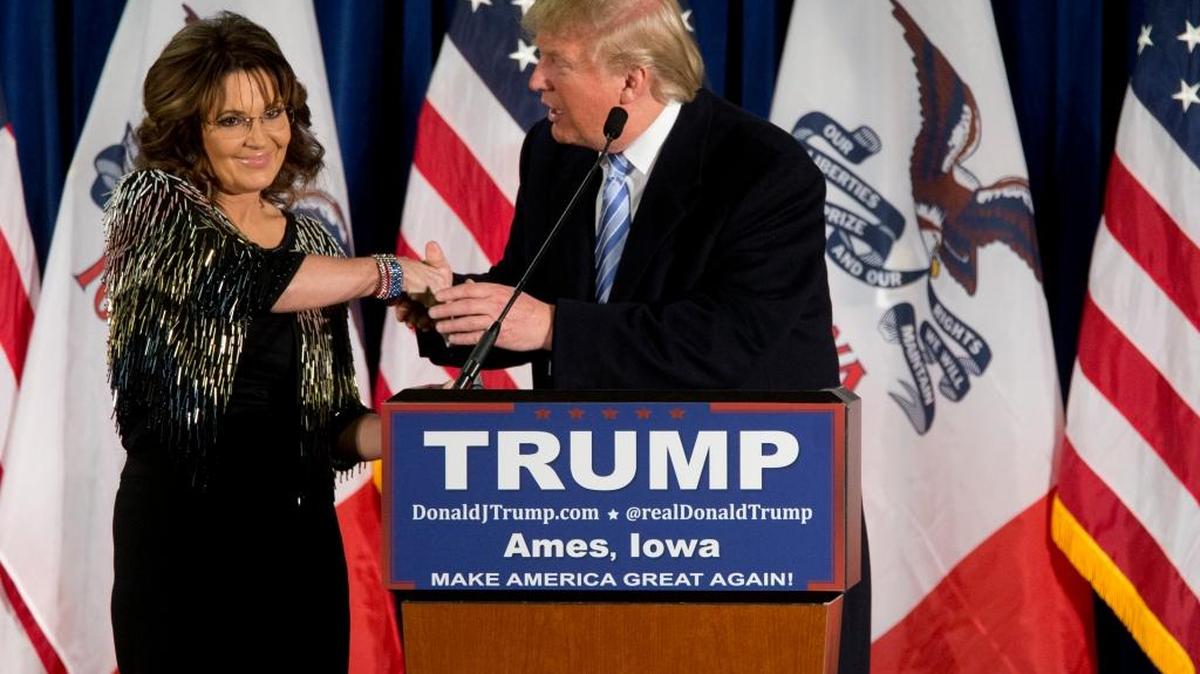 Former Alaska Gov. Sarah Palin, left, endorses Republican presidential candidate Donald Trump during a rally at the Iowa State University, Tuesday, Jan. 19, 2016, in Ames, Iowa. (AP)