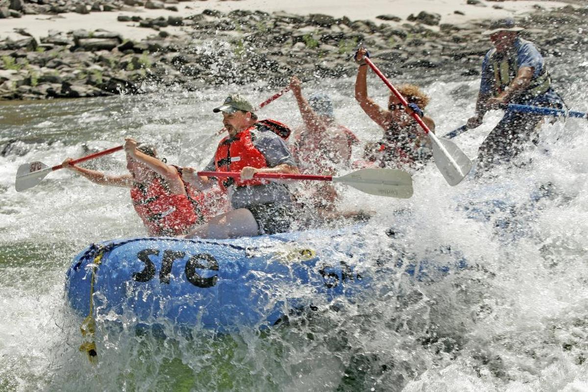A raft blasts through Time Zone Rapids on the Salmon River near Riggins.