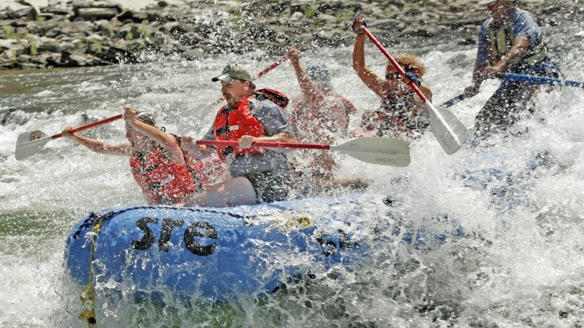 A raft blasts through Time Zone Rapids on the Salmon River near Riggins.