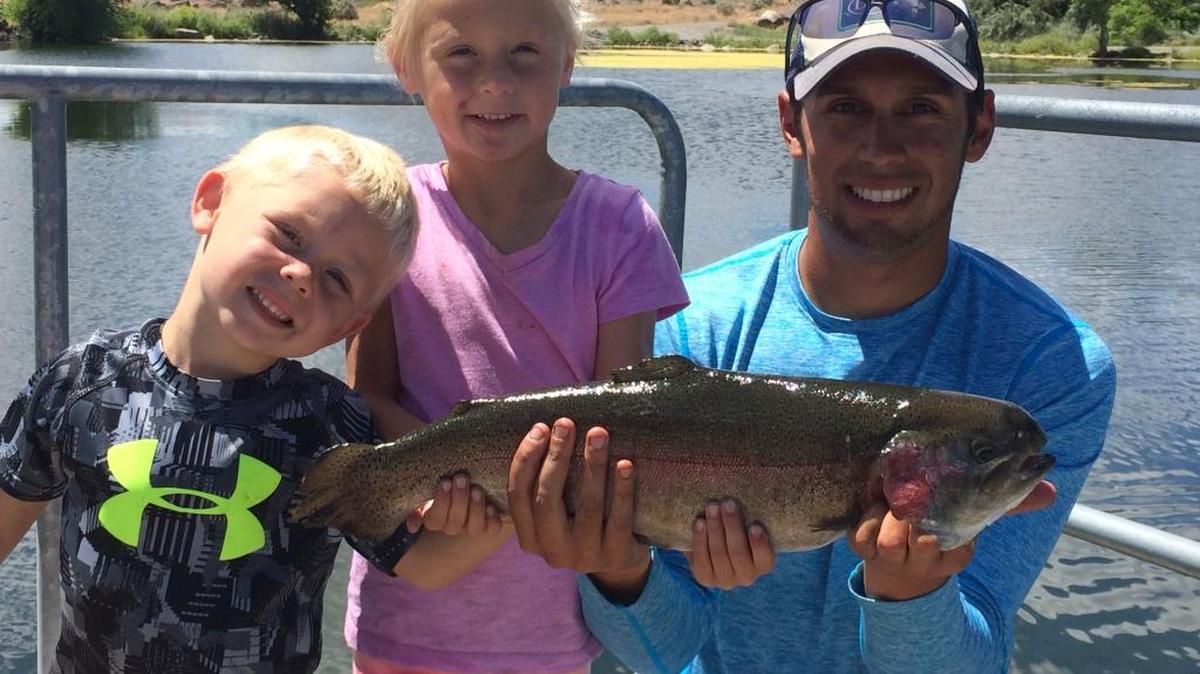 Wyatt Shippen and Chloe Shippen helped land a big rainbow trout that hit on the last cast at the Hagerman State Fish Hatchery.