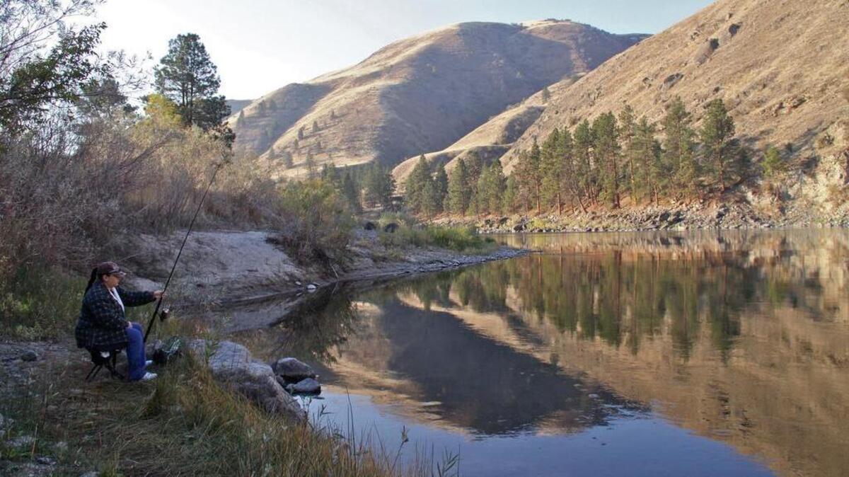 Julie Garcia of Grangeville fishes for steelhead from the bank of the Salmon River.