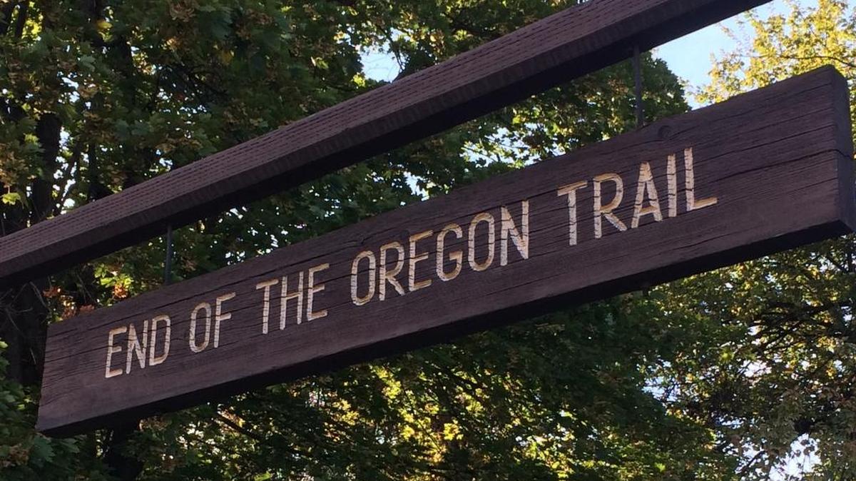 A rustic sign at the entrance to The Dalles City Park marks the official end of the old Oregon Trail.