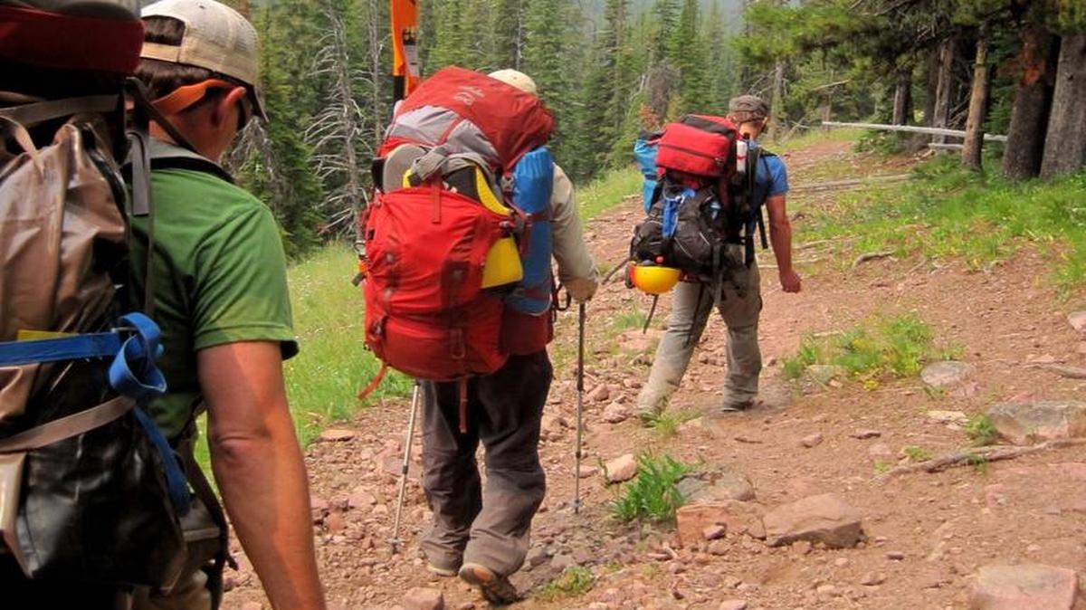 Packrafters hike up Youngs Creek Pass on a trip through Montana’s Bob Marshall Wilderness. Marshall, the co-founder of the Wilderness Society, was an early crusader for wilderness protections and the Wilderness is named after him.