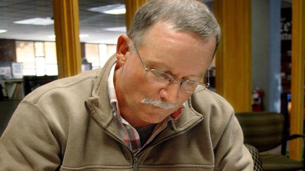 After his son’s death, Barber said he felt “morally obligated to do something” even though he is “adamantly pro gun.” It hasn’t been easy on his family. Here, he looks through documents that he’s amassed during his investigation into Remington Arms Co.