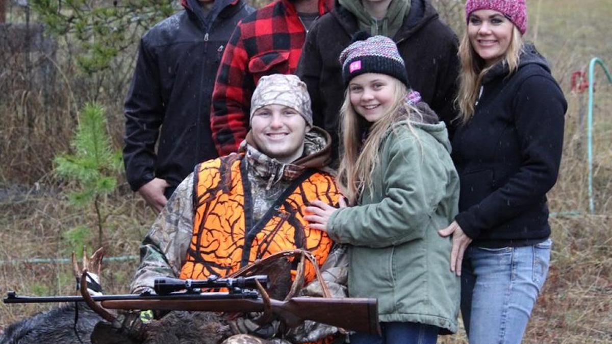 Jace Malek, 18, and his family pose with the moose he bagged in November in northeastern Washington during a special end-of-life hunt organized by Youth Outdoors Unlimited with a special permit from the Washington Department of Fish and Wildlife and help from a group of sportsmen volunteers.