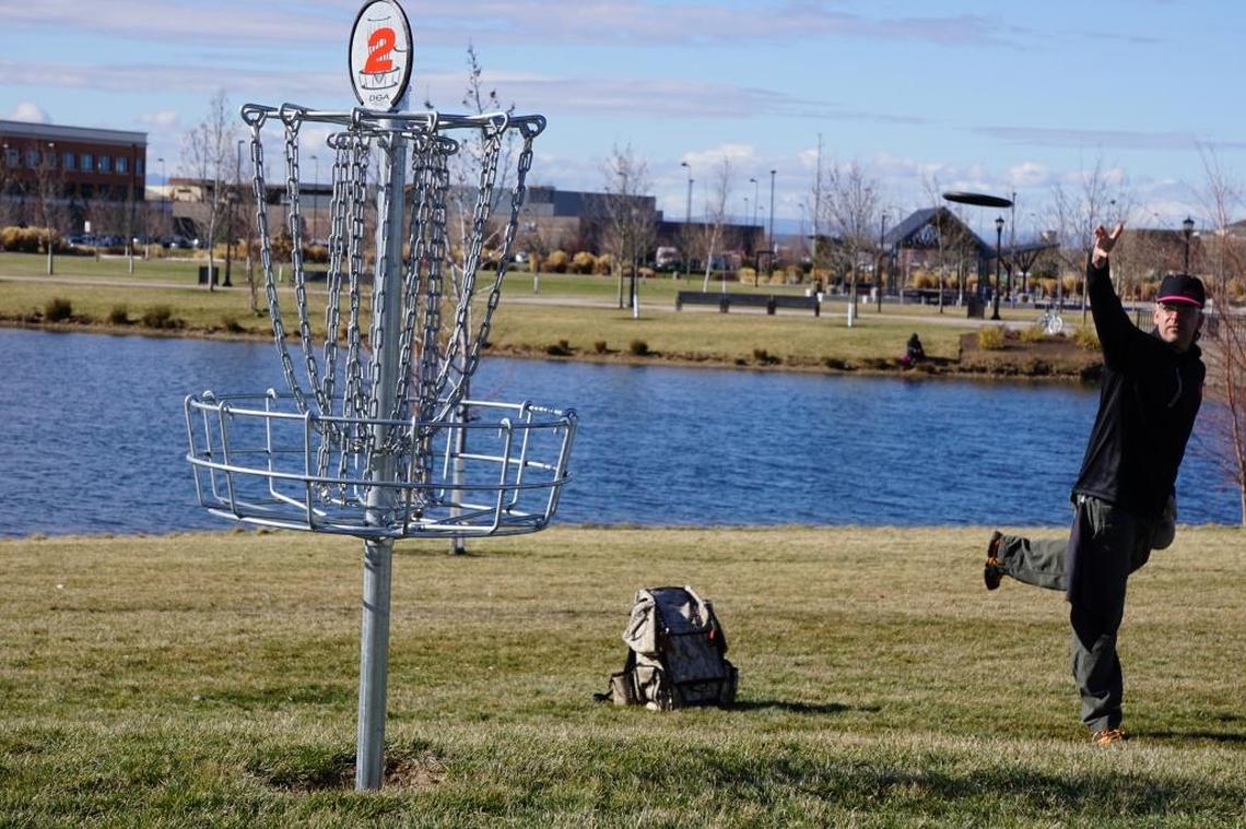 In this 2016 photo, Jason Oxsen fires a disc at the basket on the second hole of the disc golf course at Julius M. Kleiner Park in Meridian.