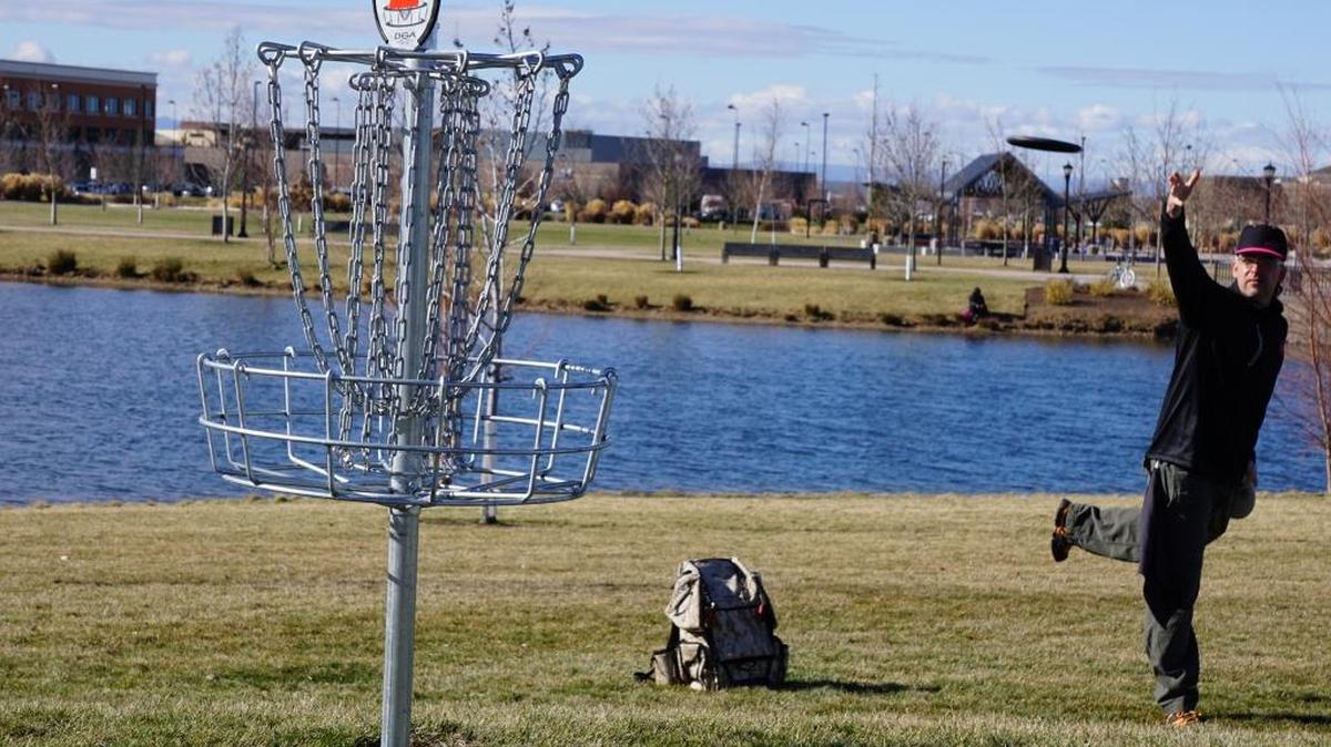 Jason Oxsen fires a disc at the basket for the second hole of the disc golf course at Kleiner Park in Meridian. Oxsen runs 208 Discs in Boise and competes professionally.