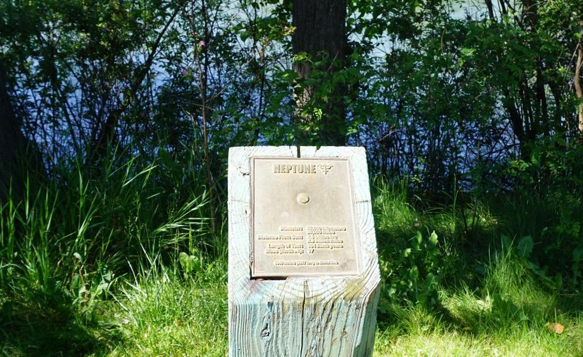Since the 1990s, a series of bollards along the Greenbelt and in Julia Davis Park have presented information about the planets, including Pluto. An upgraded version, scheduled to come in spring 2025, will leave the tiny “dwarf planet” behind.