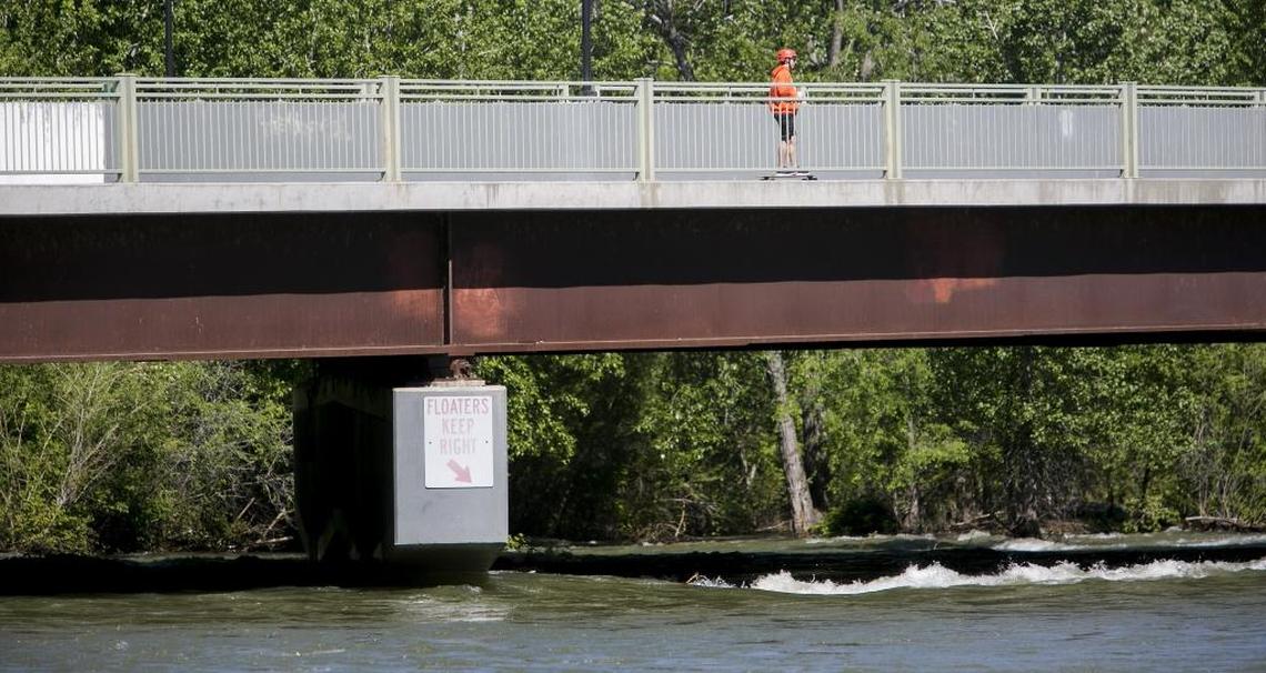 A skateboarder makes his way across the Parkcenter Bridge over the Boise River in 2017.