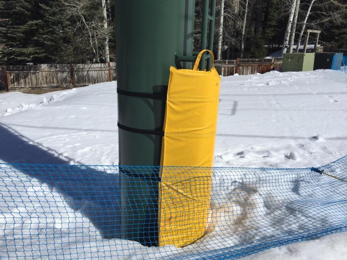 Louise Stumph and Ski Patroller Dave Swenke grabbed the pad attached to the base of the chairlift support. With help from several others, they caught Oliver when he fell.