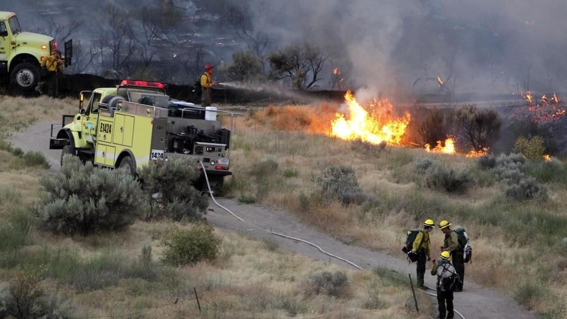 Two Idaho men pleaded guilty to wire fraud and other charges for allegedly rigging federal bids to use firefighting equipment similar to the Bureau of Land management trucks seen in this 2016 file photo near the Morningside Heights neighborhood in East Boise.