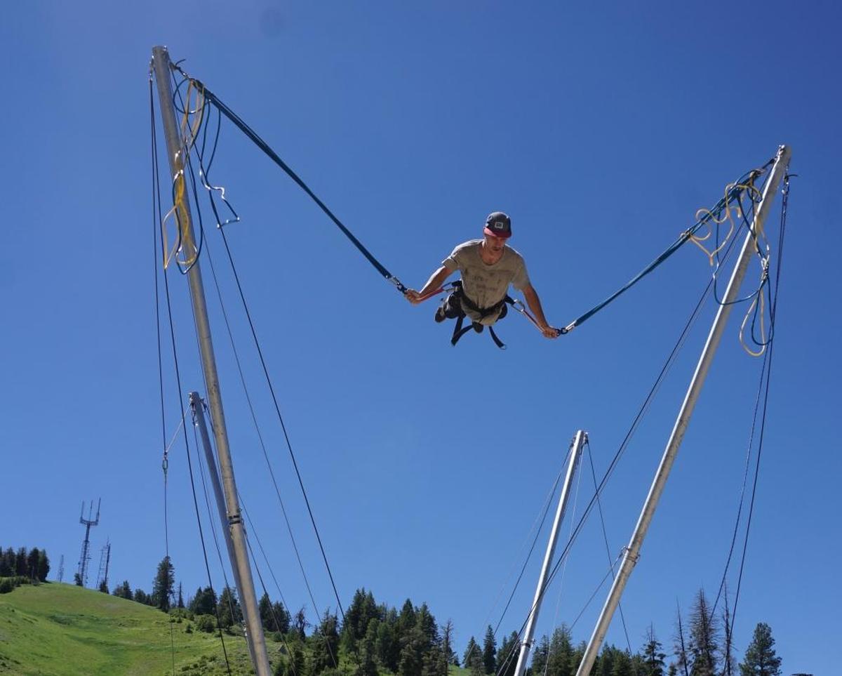 Austin Smith tries out the bungee trampoline at Bogus Basin.