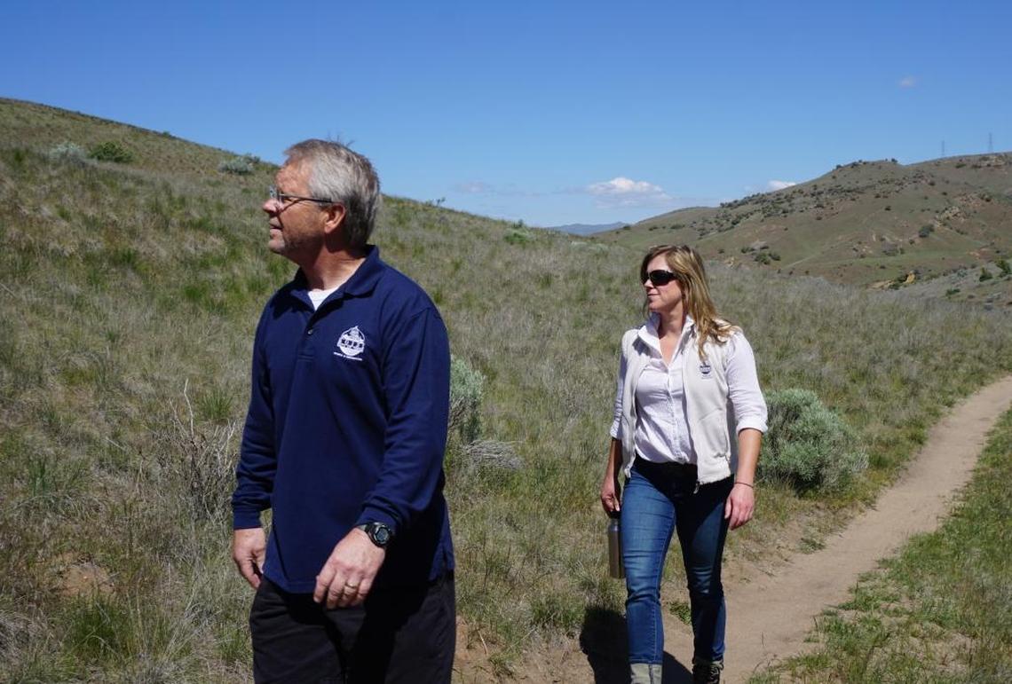 Doug Holloway, director of Boise Parks and Recreation, and Sara Arkle, Foothills and open space senior manager, hike along Peggy’s Trail.