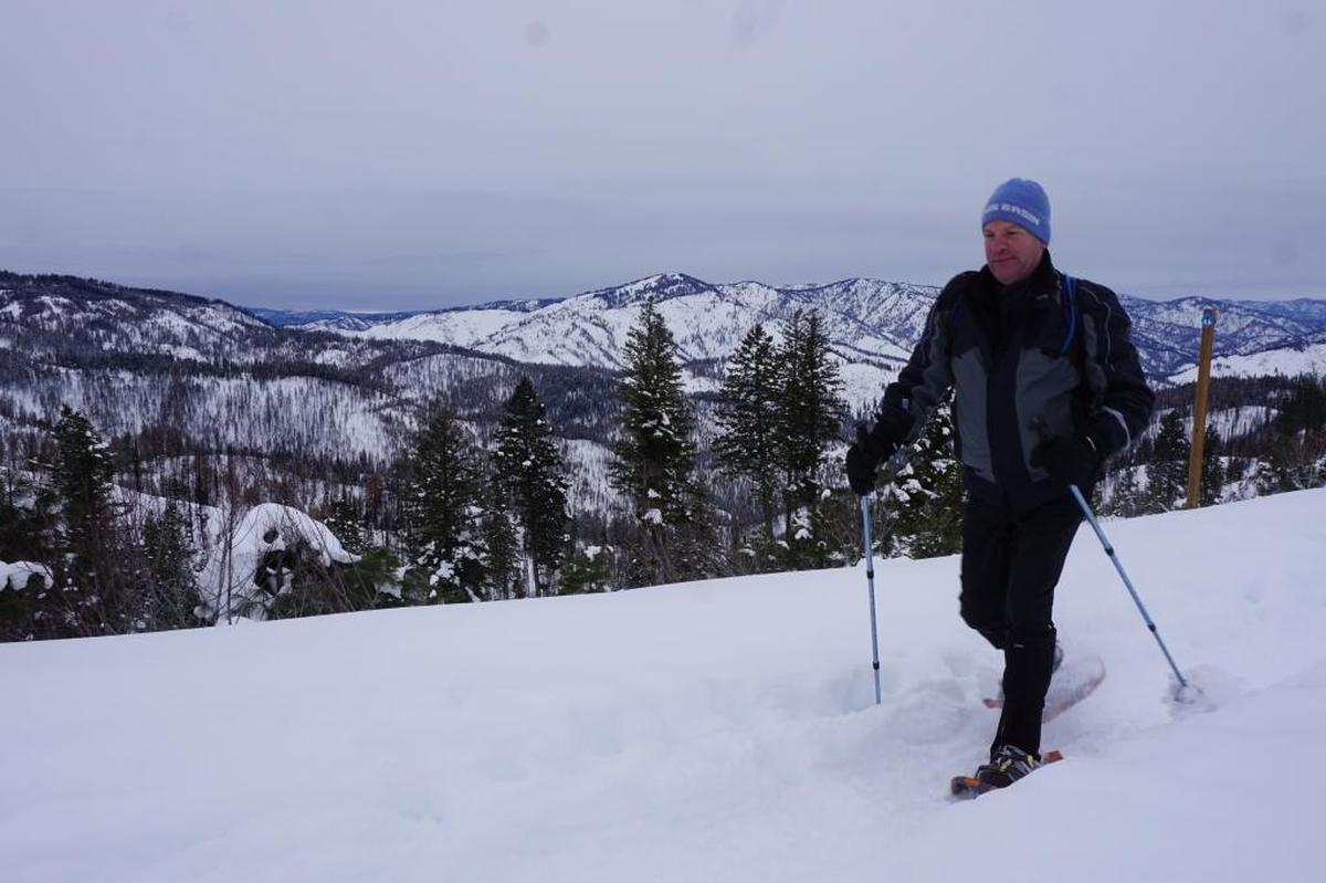 In this 2017 file photo, Scott Williams snowshoes along a ridge on his way to Stargaze Point near Idaho City. Snowshoeing has become incredibly popular this winter as people try to escape outdoors during the pandemic.
