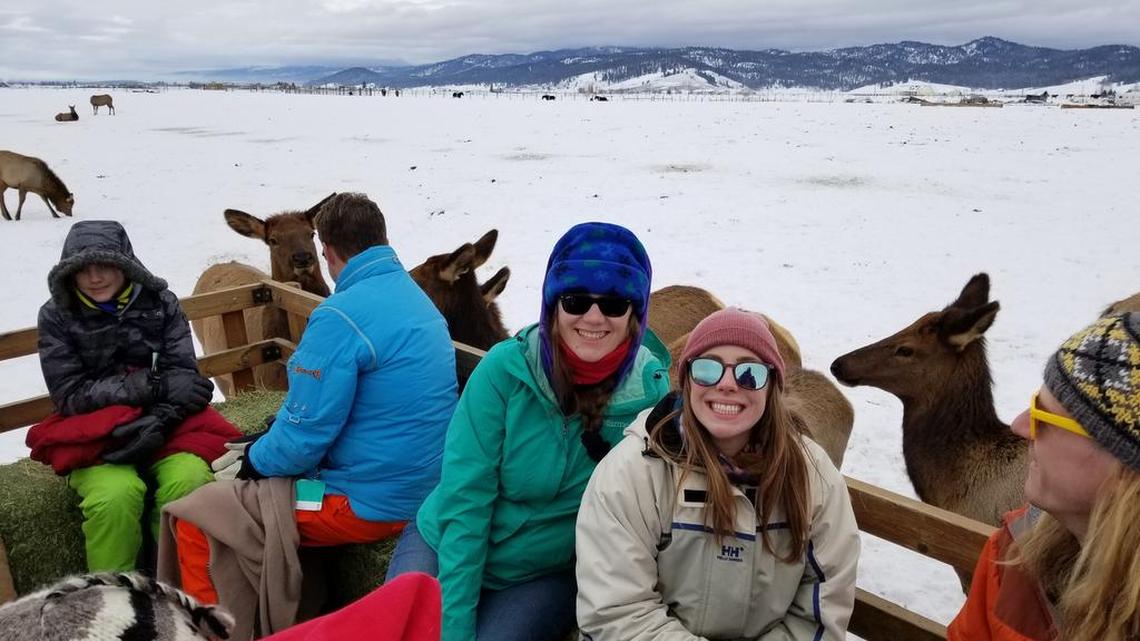 Elena Lansing, center, and Michelle Marks bundled up for below-freezing temperatures and an hourlong trip to check out wild elk on the Points Ranch near Donnelly.