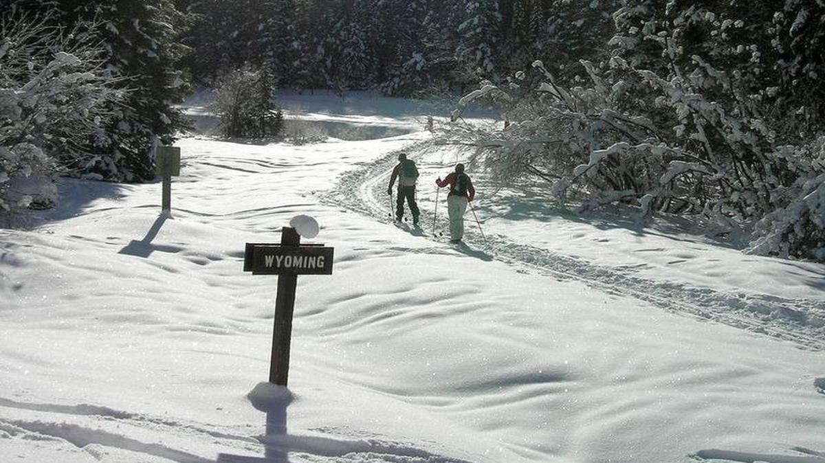 Sam Painter, left, and Julie Painter cross-country ski along the Moose Creek Road east of Victor.