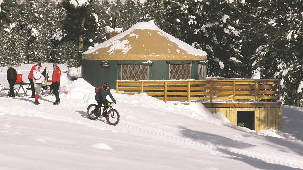 A fat bike rider leaves the warming hut at Harriman State Park on Jan. 7. Nearby, the Idaho Falls Nordic Ski Patrol set up a table with hot cocoa and chili.