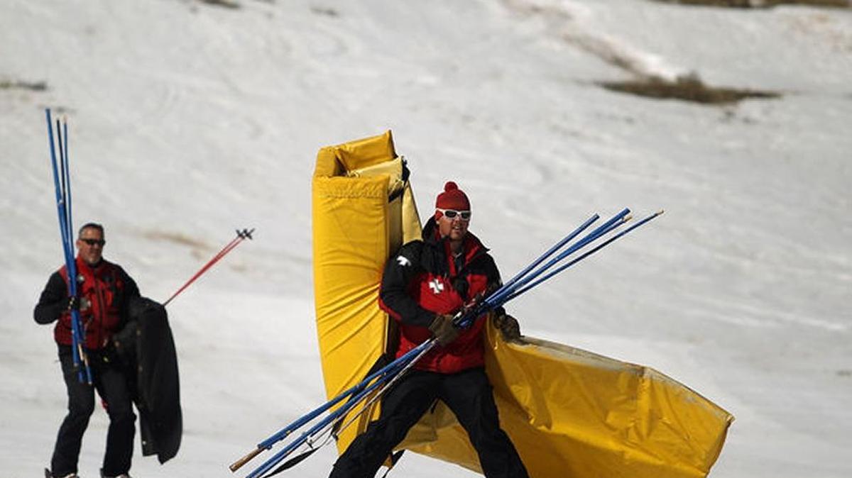 Ski patrolmen Ryan Bentley, front, and Rick Choate bring gear down off Soldier Mountain during the last snow day in March 2013 near Fairfield.